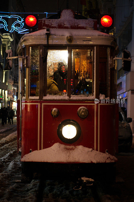 Red Tram. İstiklal Street in winter, Beyoglu, Istanbul. Incidental People
